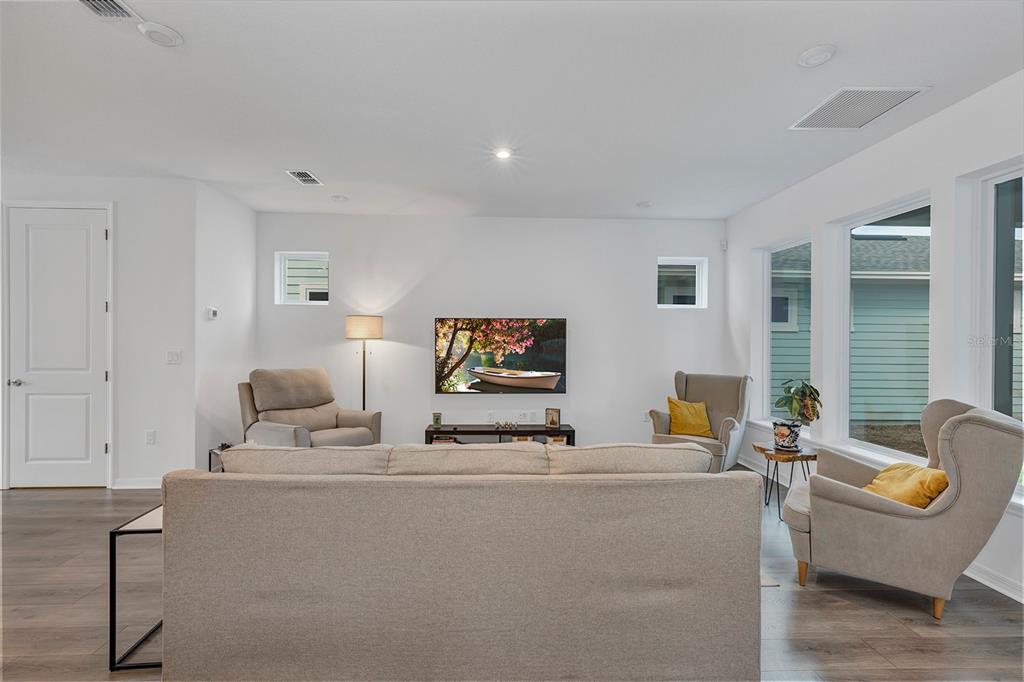 6501 Rover Way St. Cloud, FL 34771 - Photo 12 of 29 a living room with furniture and a flat screen tv