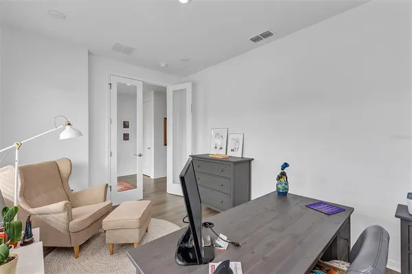 a view of a workspace with furniture