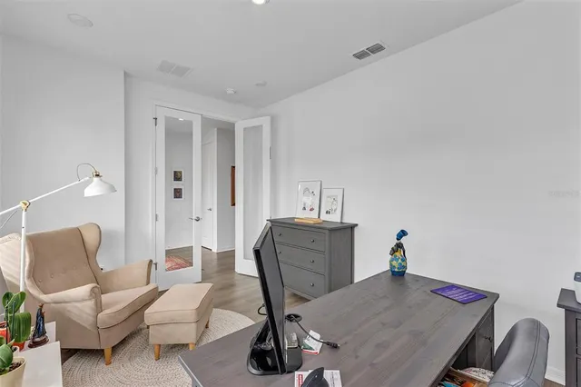 a view of a workspace with furniture