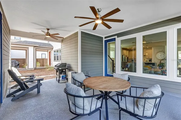 a view of a dining room with furniture and window