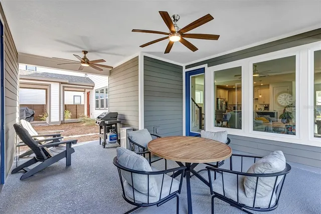 a view of a dining room with furniture and window