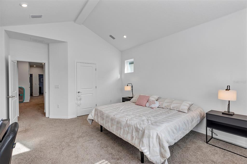 6501 Rover Way St. Cloud, FL 34771 - Photo 19 of 29 a bedroom with a bed and a lamp