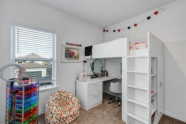a utility room with cabinets dryer and washer