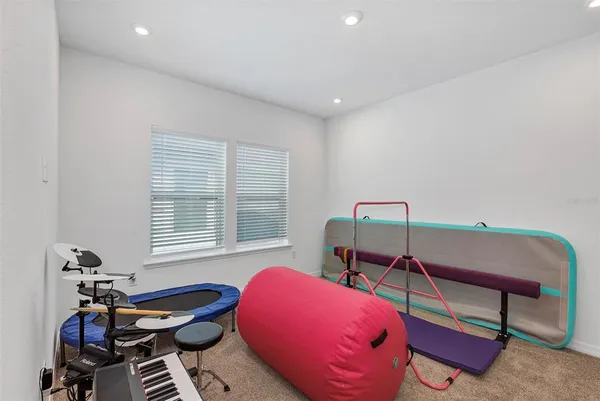 a bedroom with furniture and a window