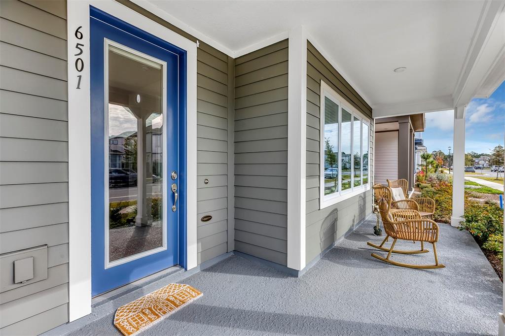 6501 Rover Way St. Cloud, FL 34771 - Photo 3 of 29 a balcony with table and chairs
