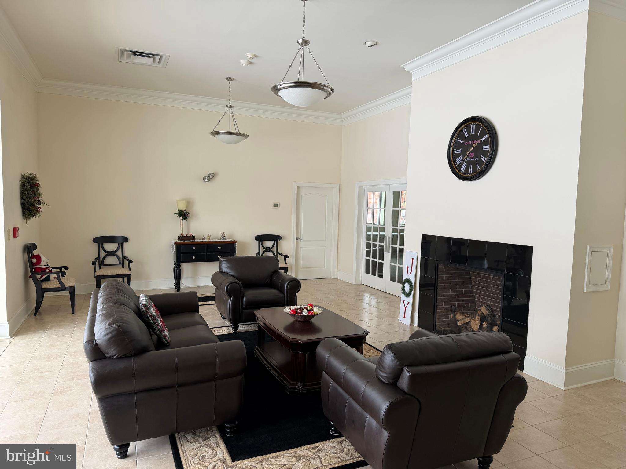 100 Aura Road, Unit 206 Clayton, NJ 08312 - Photo 21 of 25 a living room with furniture and a fireplace