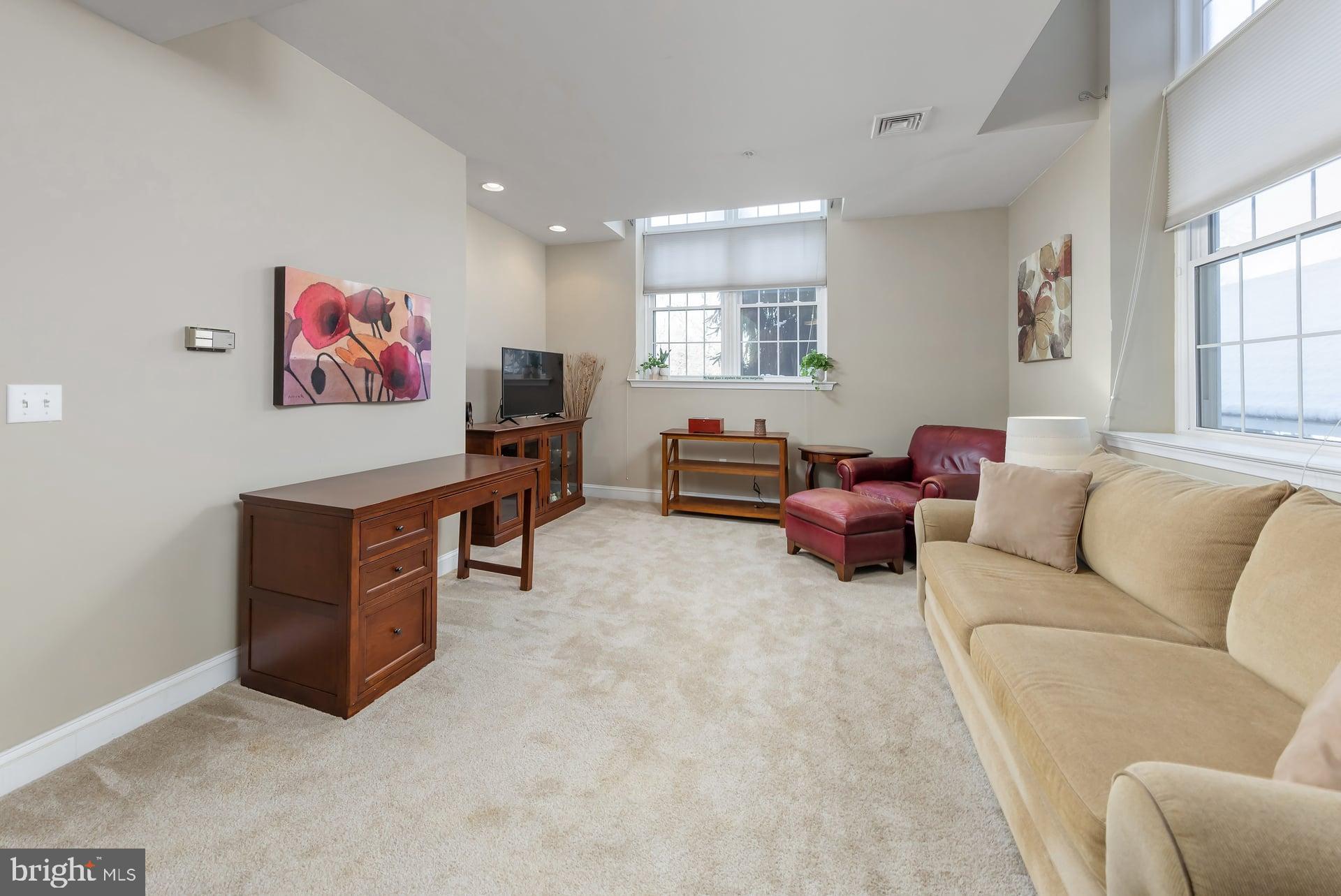 100 Aura Road, Unit 206 Clayton, NJ 08312 - Photo 4 of 25 a living room with furniture and a window