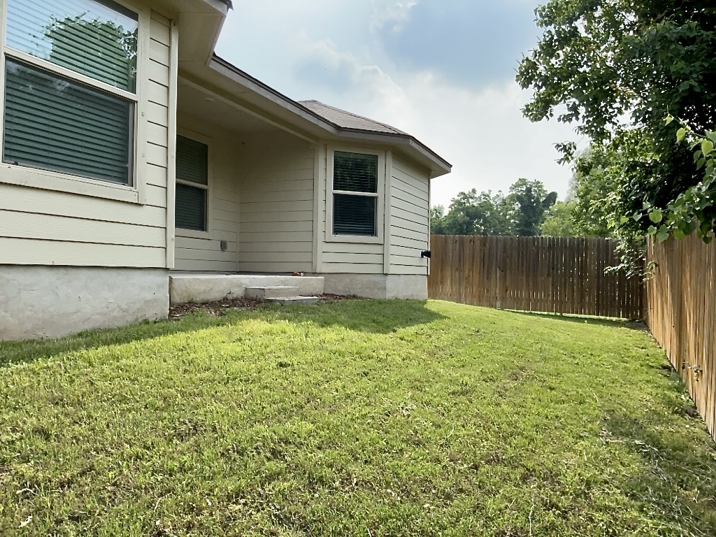 124 Marcel Court Taylor, TX 76574 - Photo 15 of 17 Fenced backyard and covered patio