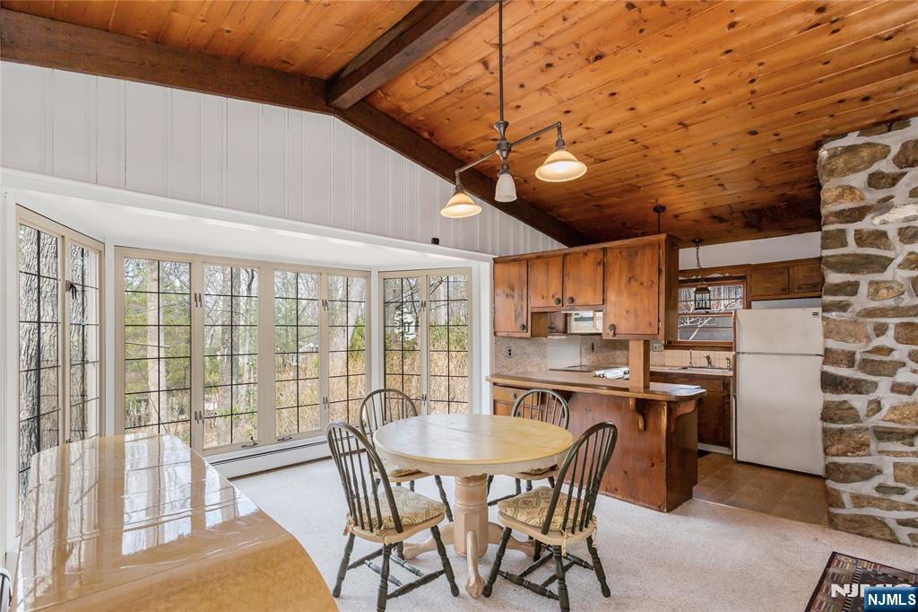 6 Partridge Trail Butler, NJ 07405 - Photo 11 of 37 a kitchen with stainless steel appliances granite countertop a stove a sink dishwasher and a refrigerator with wooden cabinets