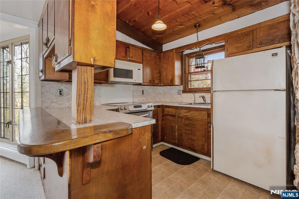 6 Partridge Trail Butler, NJ 07405 - Photo 12 of 37 a kitchen with appliances cabinets and a sink