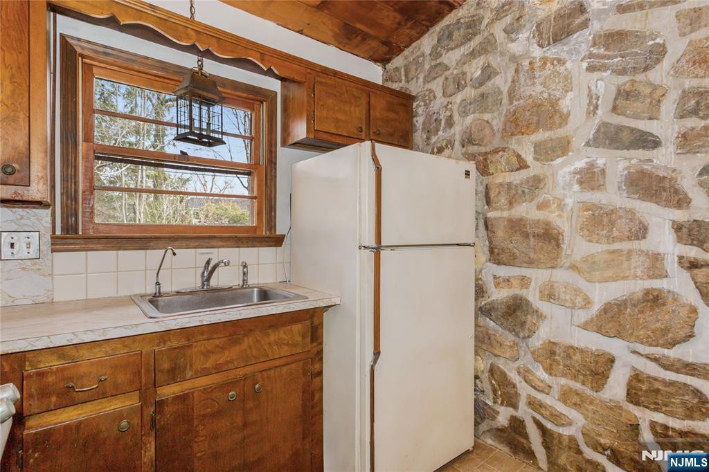 6 Partridge Trail Butler, NJ 07405 - Photo 14 of 37 a white sink sitting next to a white cabinet
