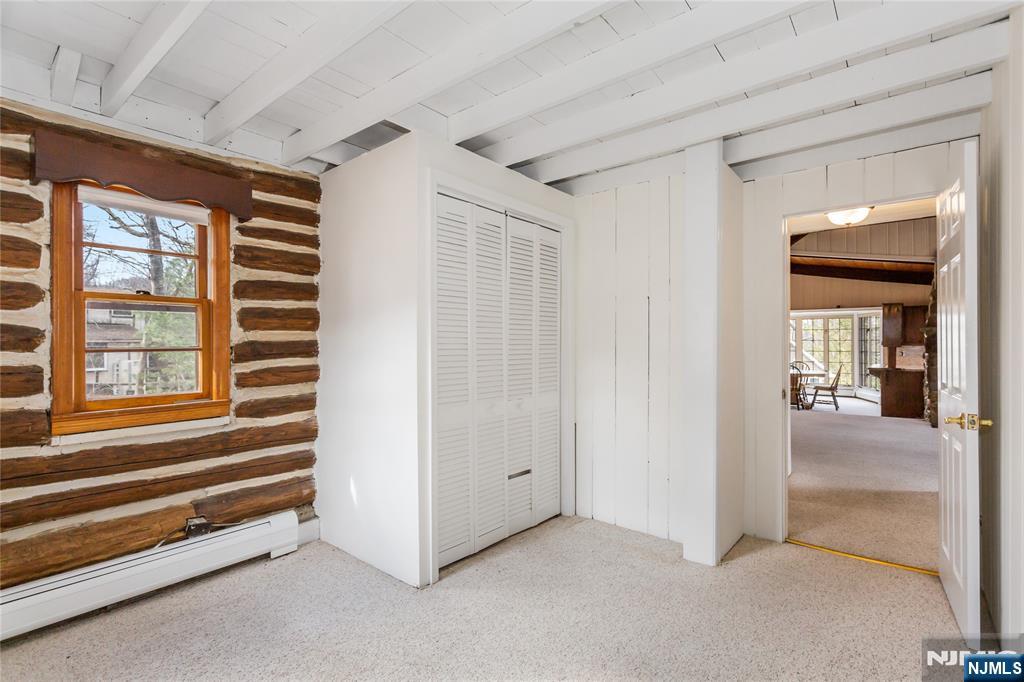 6 Partridge Trail Butler, NJ 07405 - Photo 15 of 37 a view of an empty room with a birdcage and a window
