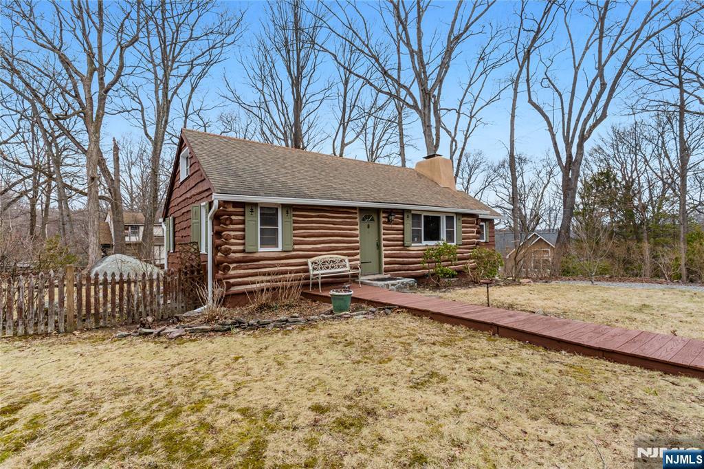 6 Partridge Trail Butler, NJ 07405 - Photo 2 of 37 a front view of a house with a yard