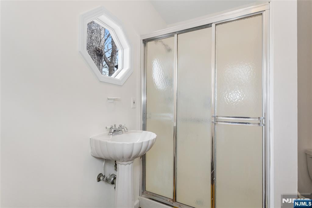 6 Partridge Trail Butler, NJ 07405 - Photo 22 of 37 a bathroom with a sink and a mirror