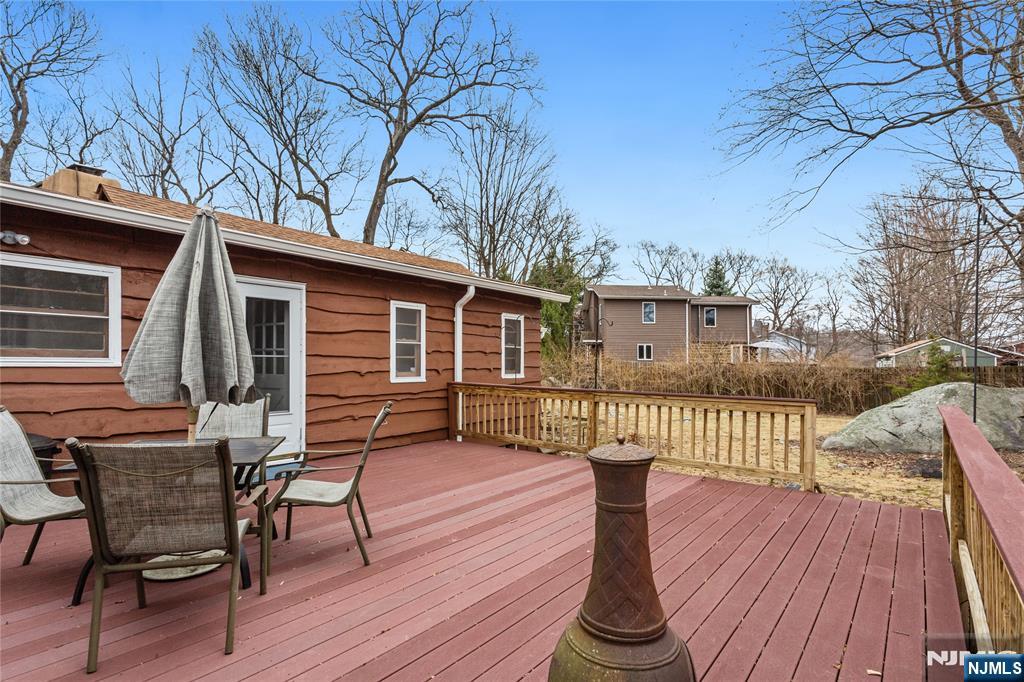 6 Partridge Trail Butler, NJ 07405 - Photo 30 of 37 a view of a house with wooden deck and furniture