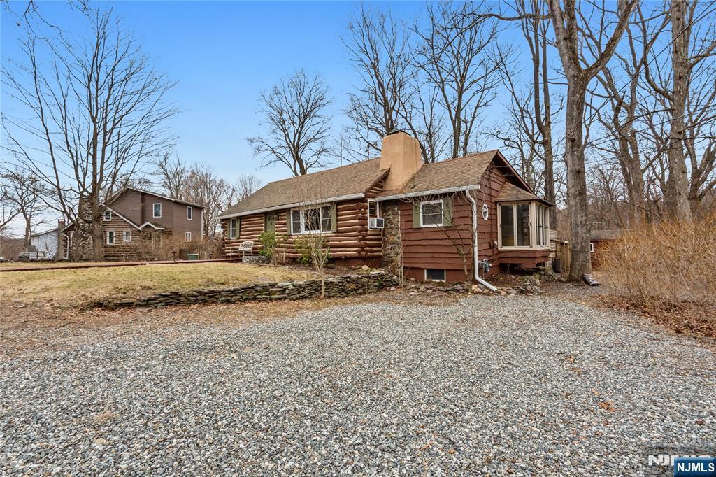 6 Partridge Trail Butler, NJ 07405 - Photo 36 of 37 a front view of a house with a yard