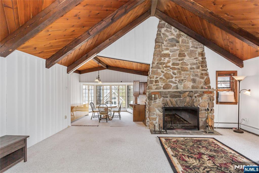 6 Partridge Trail Butler, NJ 07405 - Photo 4 of 37 a dining room with furniture and a fireplace
