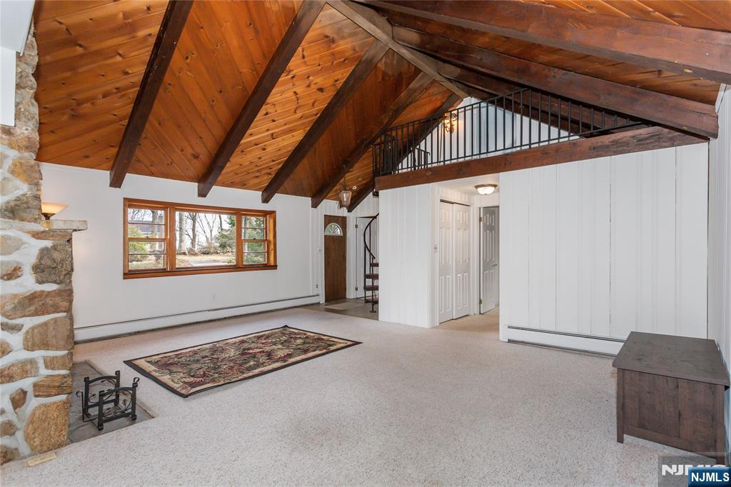 6 Partridge Trail Butler, NJ 07405 - Photo 6 of 37 a view of an empty room with windows