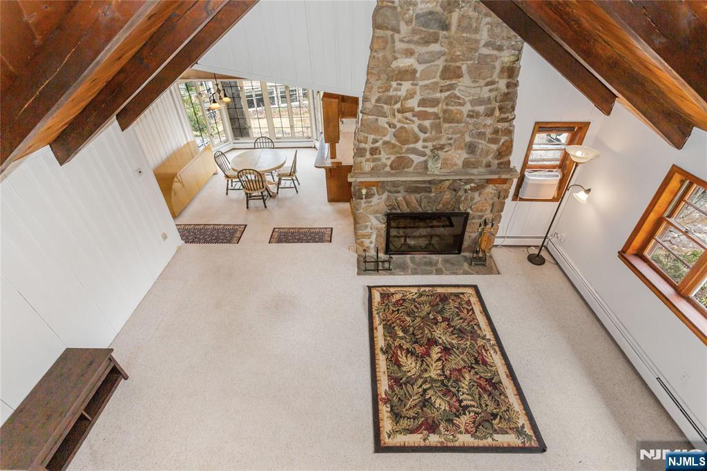 6 Partridge Trail Butler, NJ 07405 - Photo 8 of 37 a living room with furniture and a fireplace
