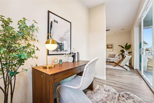 a workspace with furniture and wooden floor
