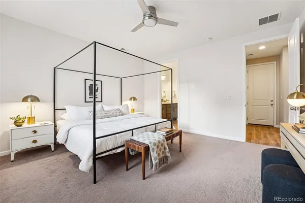 a bedroom with a bed a desk and chair