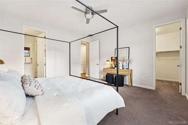 a bedroom with a bed and a table