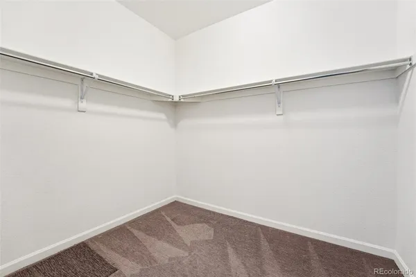 a view of a room with shelf on the wall