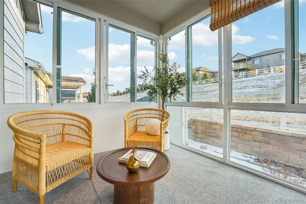 a view of a swimming pool with furniture