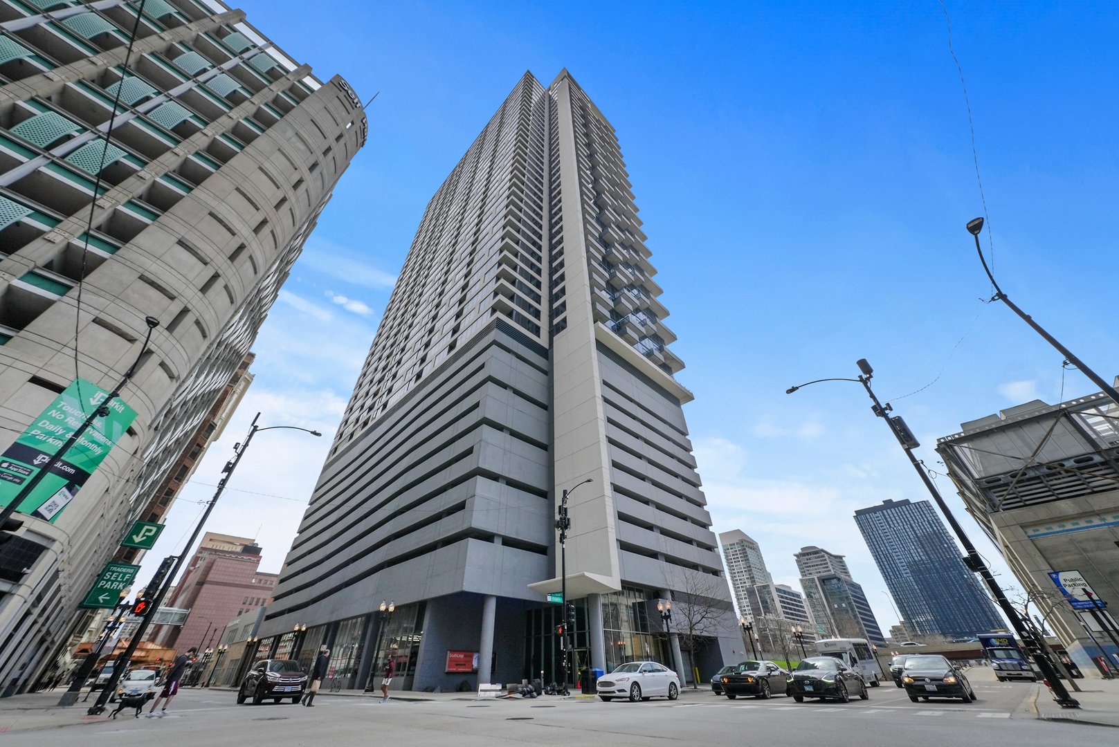235 West Van Buren Street, Unit 3509 Chicago, IL 60607 - Photo 1 of 19 a view of a tall building next to a road