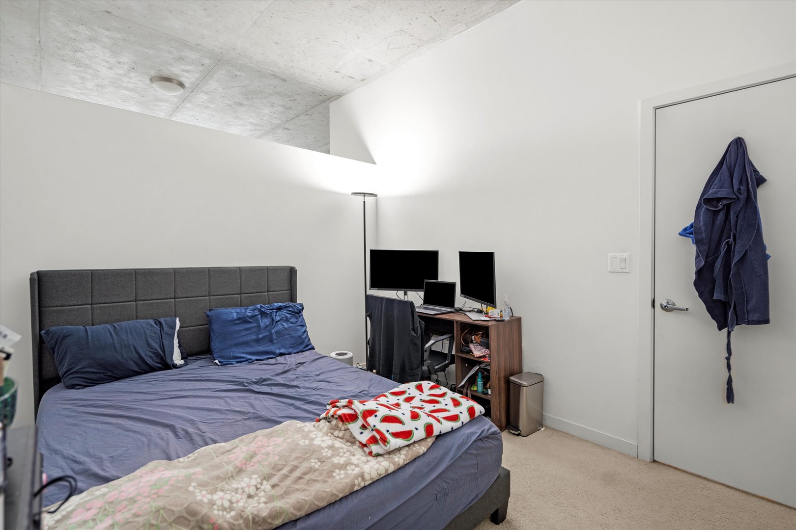 235 West Van Buren Street, Unit 3509 Chicago, IL 60607 - Photo 11 of 19 a bedroom with a bed and a flat screen tv