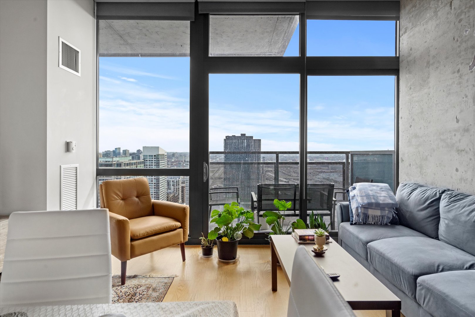 235 West Van Buren Street, Unit 3509 Chicago, IL 60607 - Photo 4 of 19 a living room with furniture and a floor to ceiling window