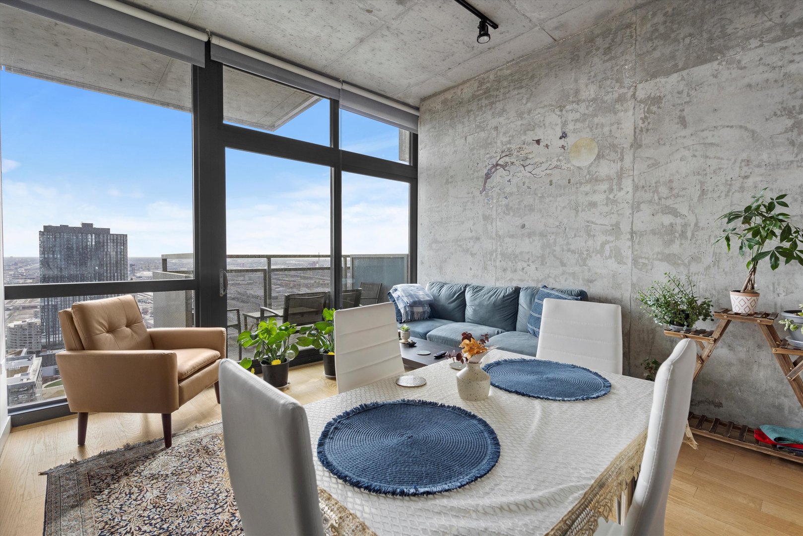 235 West Van Buren Street, Unit 3509 Chicago, IL 60607 - Photo 5 of 19 a living room with furniture and a floor to ceiling window