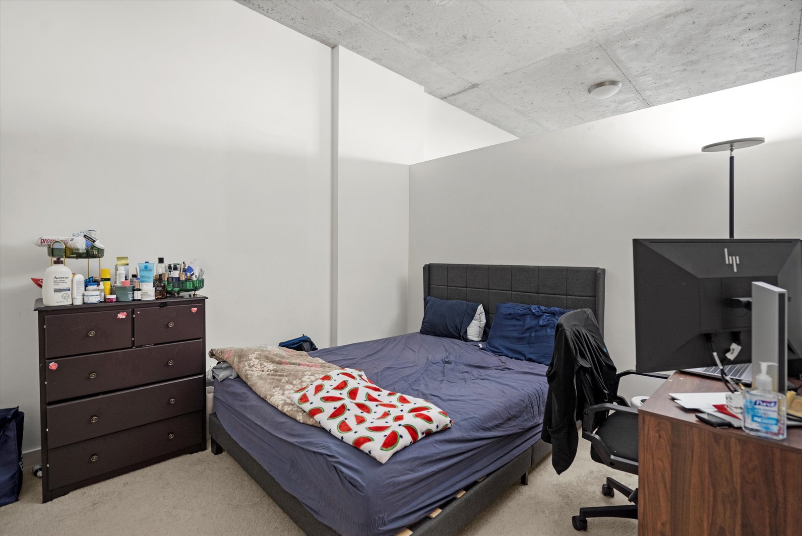 235 West Van Buren Street, Unit 3509 Chicago, IL 60607 - Photo 10 of 19 a bedroom with a bed and a dresser