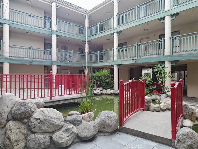 a view of a chair and table in the roof deck