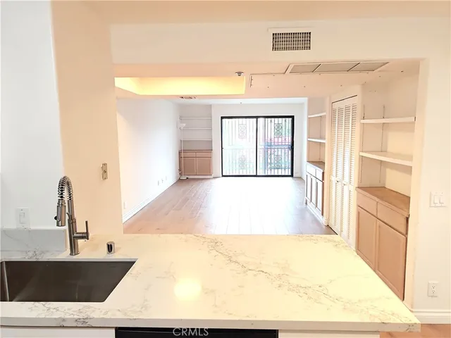 a view of a living room with a large window