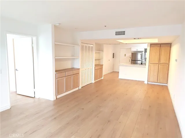 a view of a kitchen with wooden floor