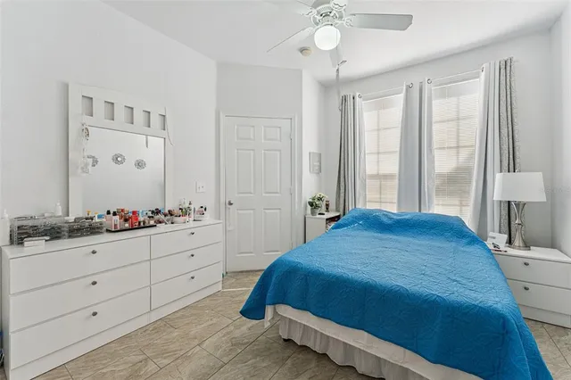 a bedroom with a bed and a dresser