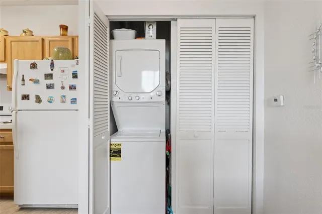 a close up of a utility room with dryer and washer