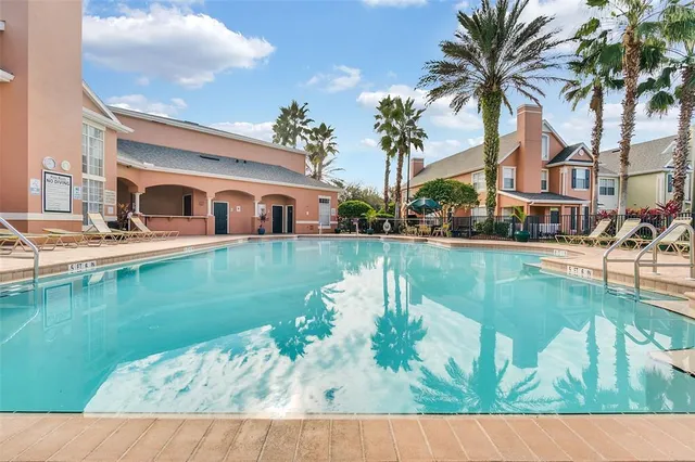 a swimming pool view with a lake view