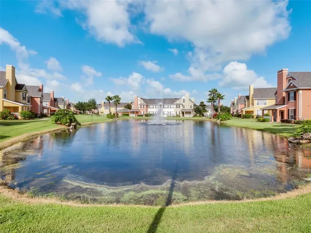 a view of a lake with boats and residential houses