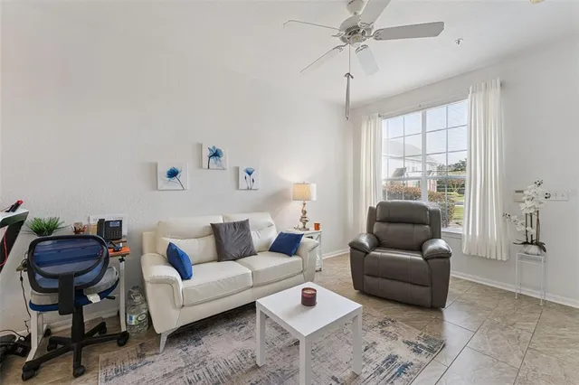 a living room with furniture and a window