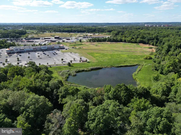 an aerial view of a houses with a yard
