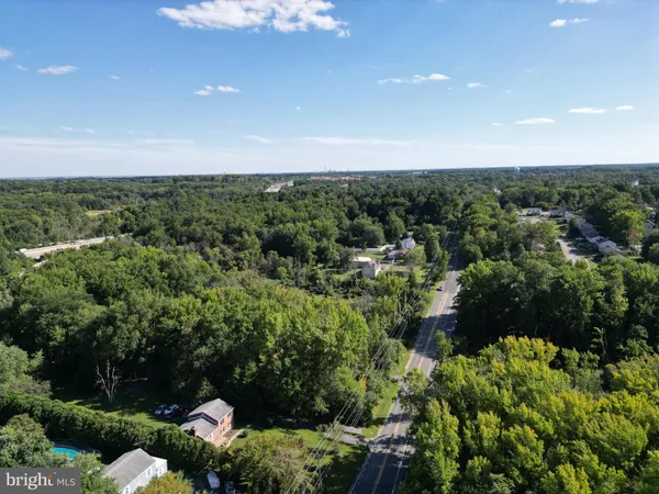 a big yard with large trees and a big yard