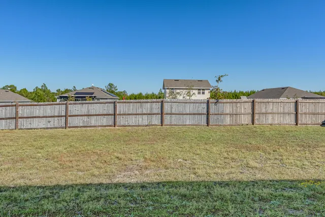 a big house with a big yard and large trees