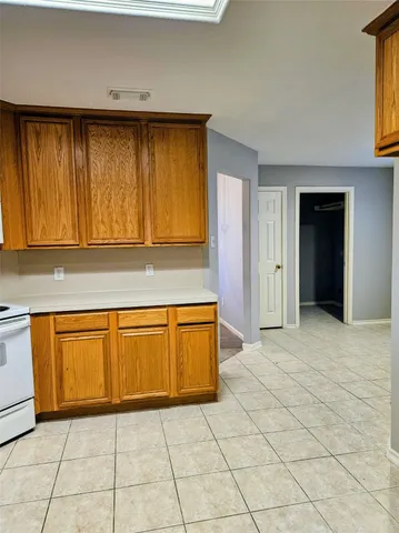 a view of a kitchen with dishwasher and cabinets