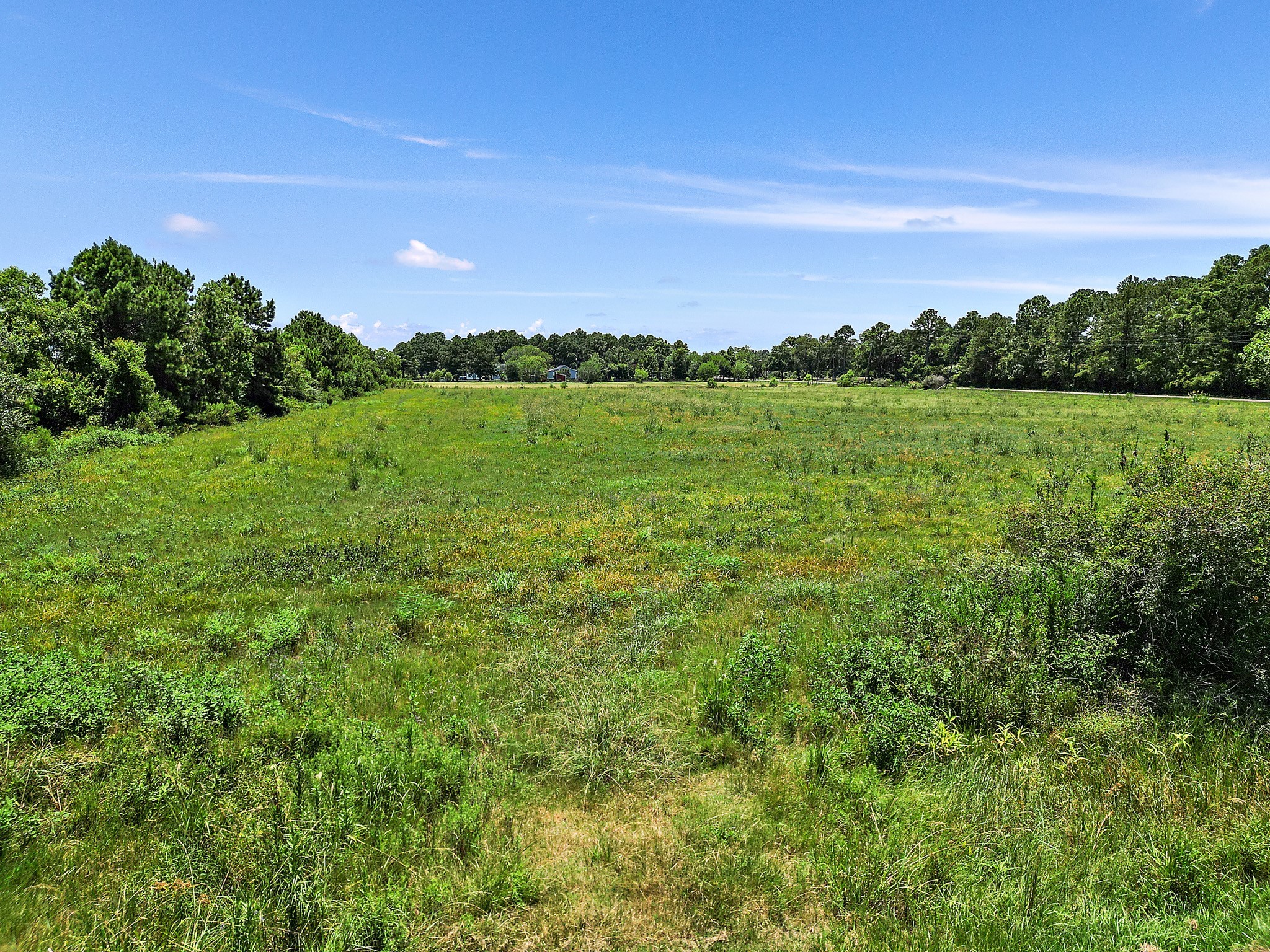 0 South Main Street Anahuac, TX 77514 - Photo 12 of 17 a view of a city and lush green forest