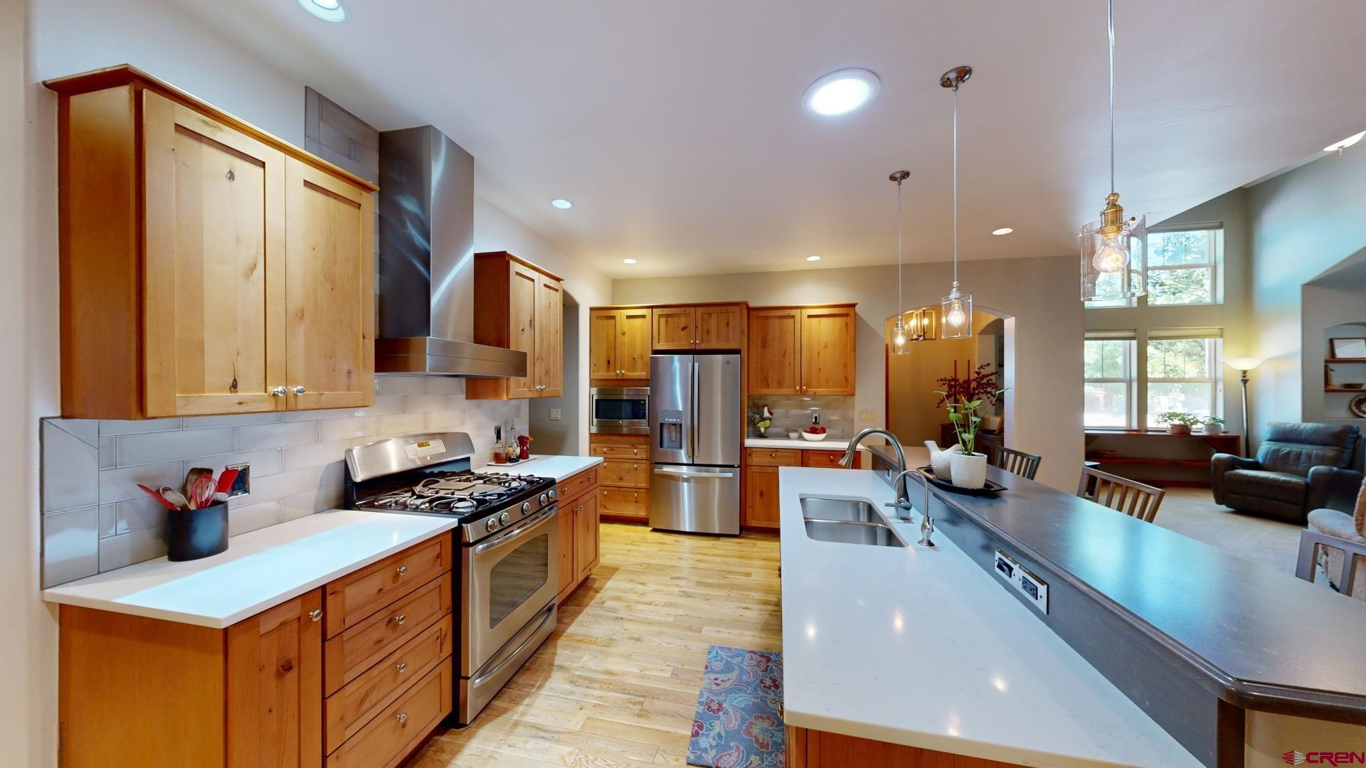 222 Jenkins Ranch Road Durango, CO 81301 - Photo 11 of 30 a kitchen with lots of counter top space and living room