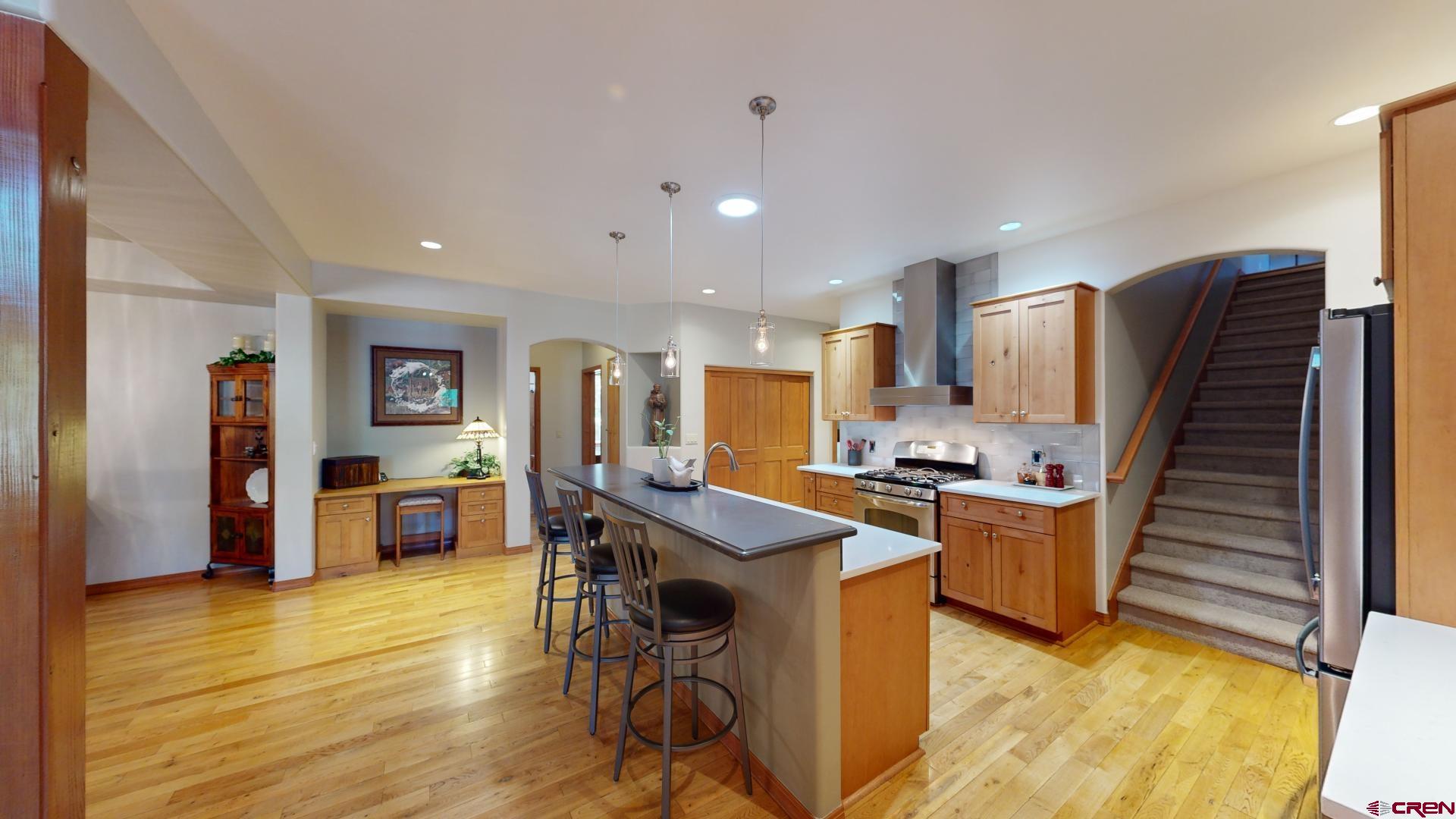 222 Jenkins Ranch Road Durango, CO 81301 - Photo 12 of 30 a room with stainless steel appliances kitchen island granite countertop furniture wooden floor and a view of kitchen