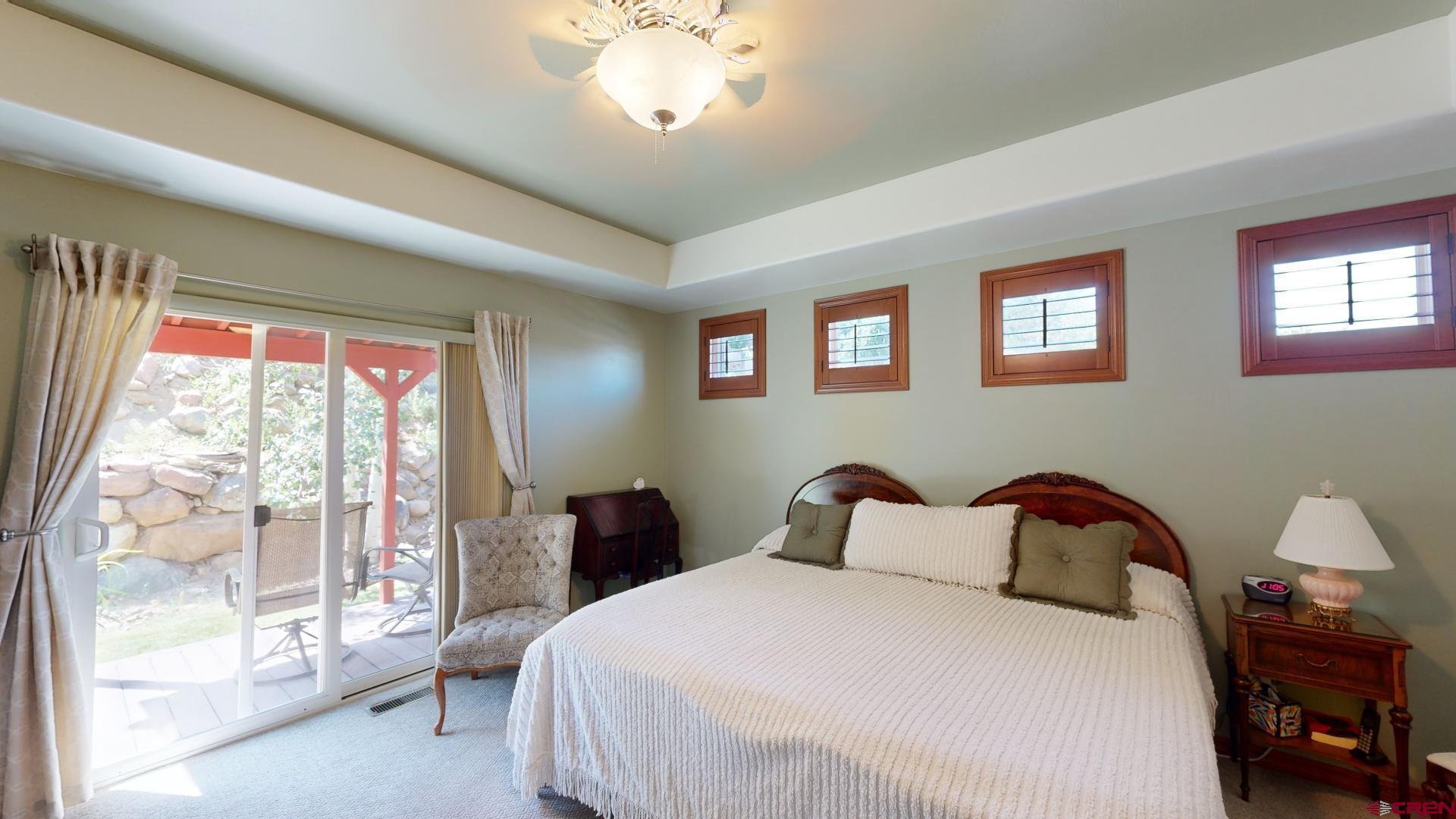 222 Jenkins Ranch Road Durango, CO 81301 - Photo 17 of 30 a bedroom with a bed and a large window