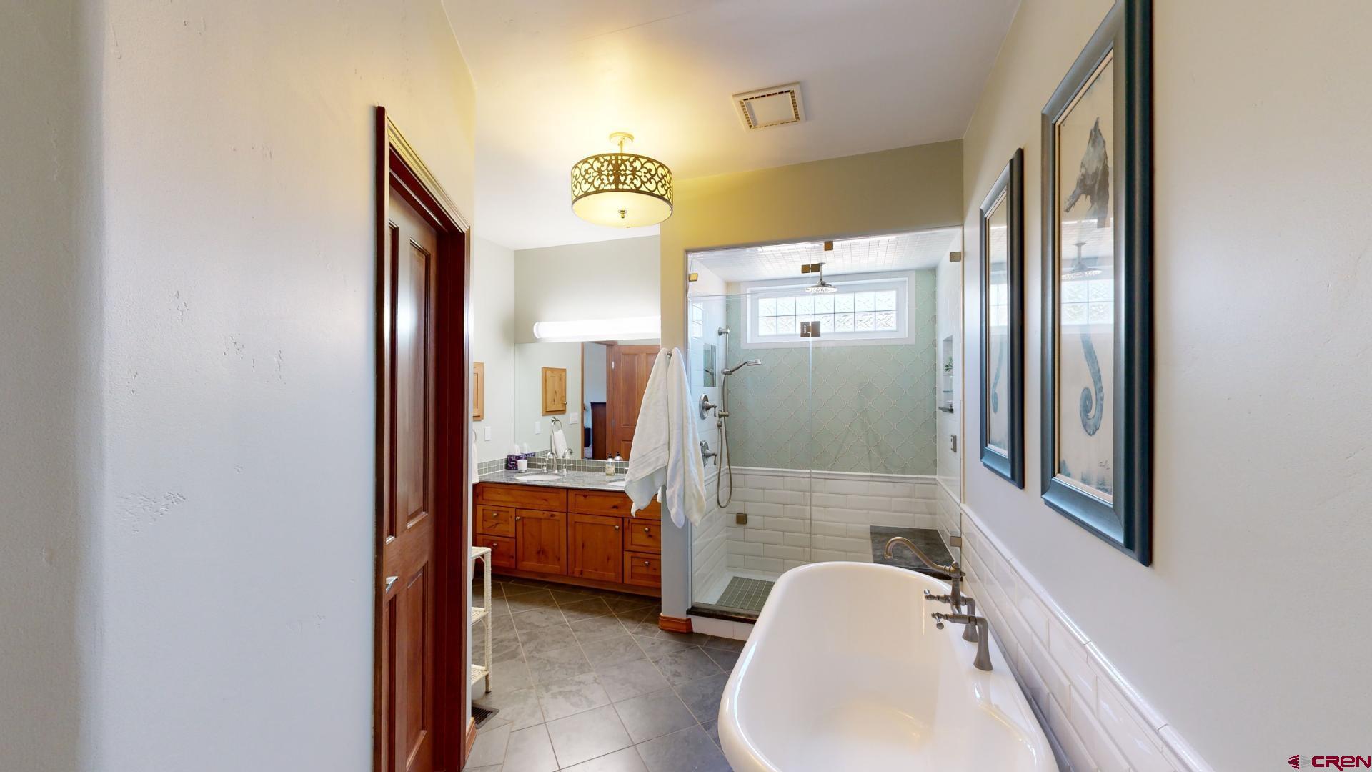 222 Jenkins Ranch Road Durango, CO 81301 - Photo 20 of 30 a bathroom with a tub sink and mirror